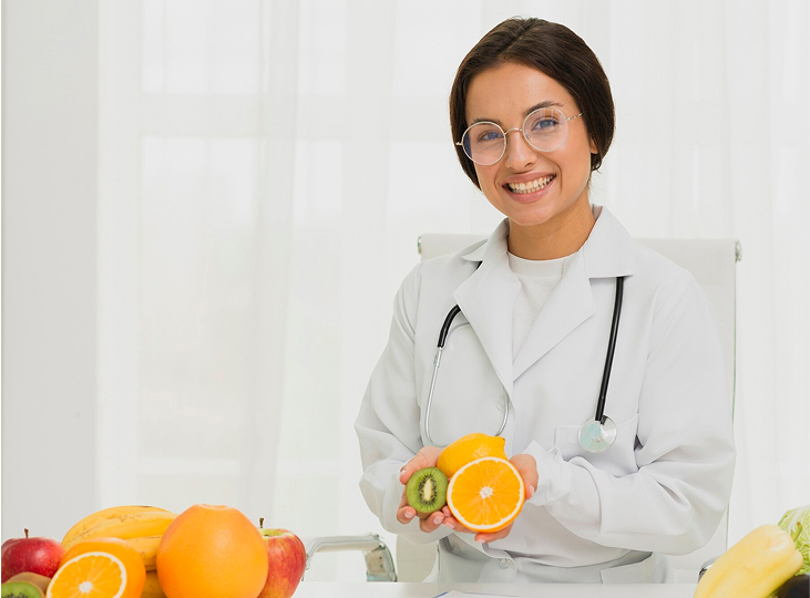 Medium shot happy doctor with orange and kiwi